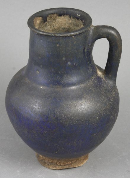 Appraisal: th th Century or older small black glazed one-handled jar