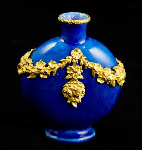 Appraisal: SMALL BLUE SOUFFLE VASE WITH ORMOLU DRAPERY SIGNED MP SEVRES