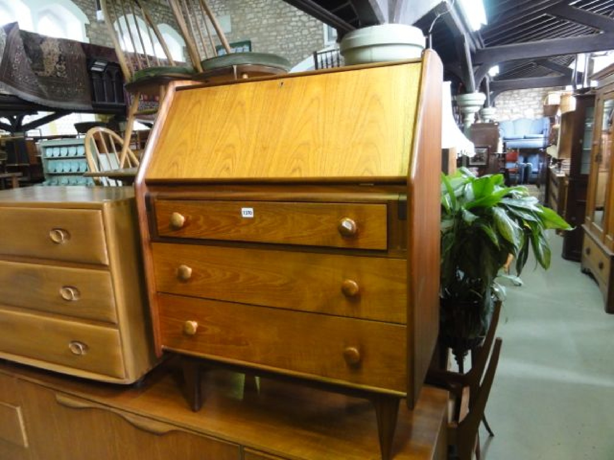 Appraisal: A mid th century teak bureau the fall front enclosing