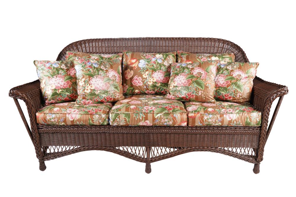 Appraisal: WICKER SOFAwith removable floral cushions Condition areas of rub wear