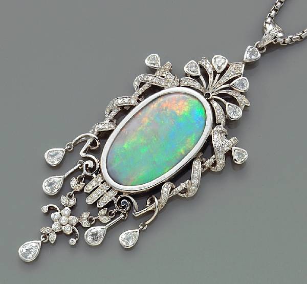 Appraisal: An opal and diamond pendant with chain centering one large