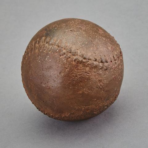 Appraisal: ACast Iron Baseball Form DoorstopDiameter approximately inches C The Nelson