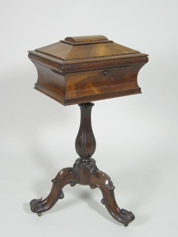 Appraisal: A Victorian rosewood Teapoy of sarcophagus shape the hinged lid