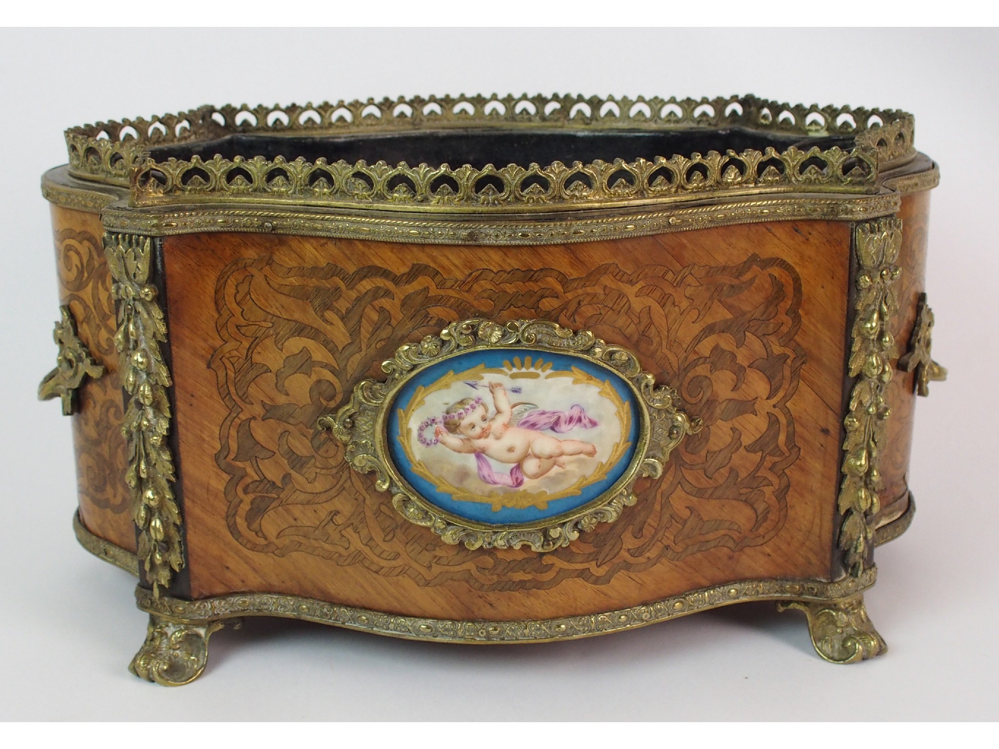 Appraisal: A Louis XV style parquetry oval shaped planterwith Sevres style