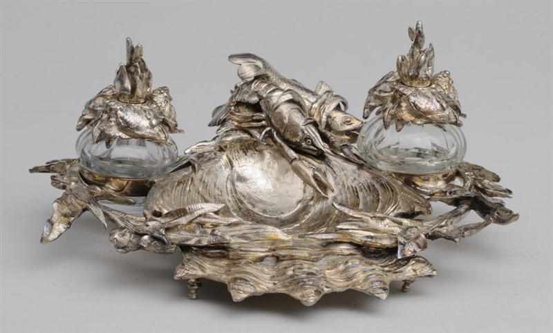 Appraisal: CONTINENTAL SILVER-PLATED ENCRIER The scalloped shell-form dish flanked by aquatic