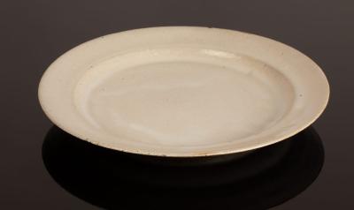 Appraisal: Rupert Spira born stoneware plate cream speckled glaze impressed seal