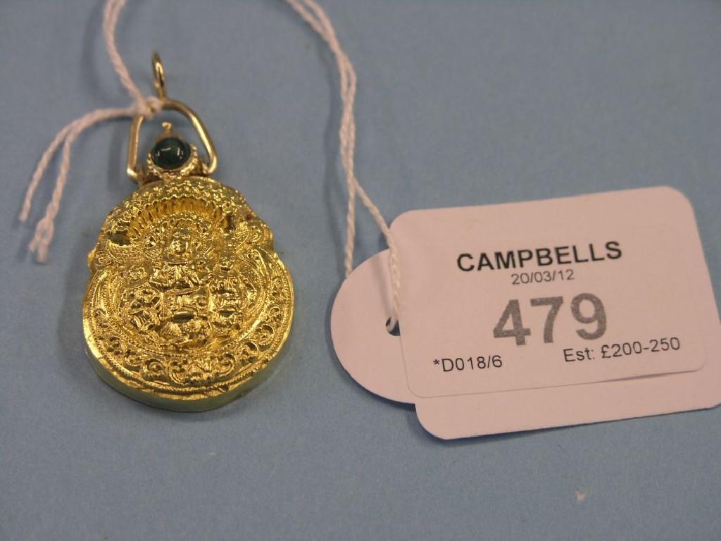 Appraisal: An Indian high-carat gold pendant elaborately embossed and with inset