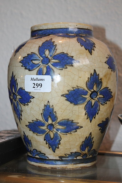 Appraisal: A PERSIAN BALUSTER VASE with blue stylised flowers on a