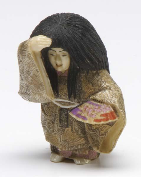 Appraisal: JAPANESE NETSUKE Carved ivory dancer with fan with stained and