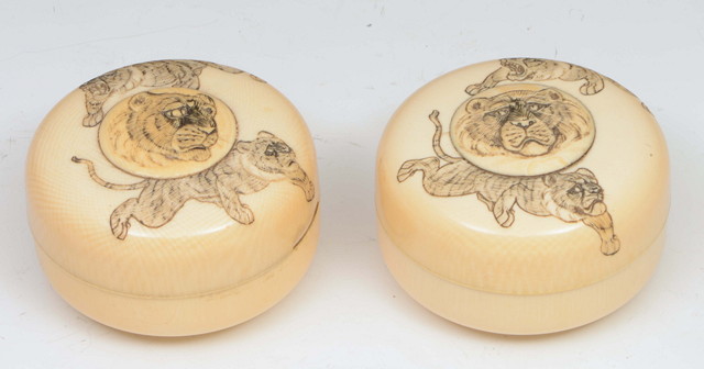 Appraisal: A PAIR OF JAPANESE IVORY CYLINDRICAL BOXES the covers with