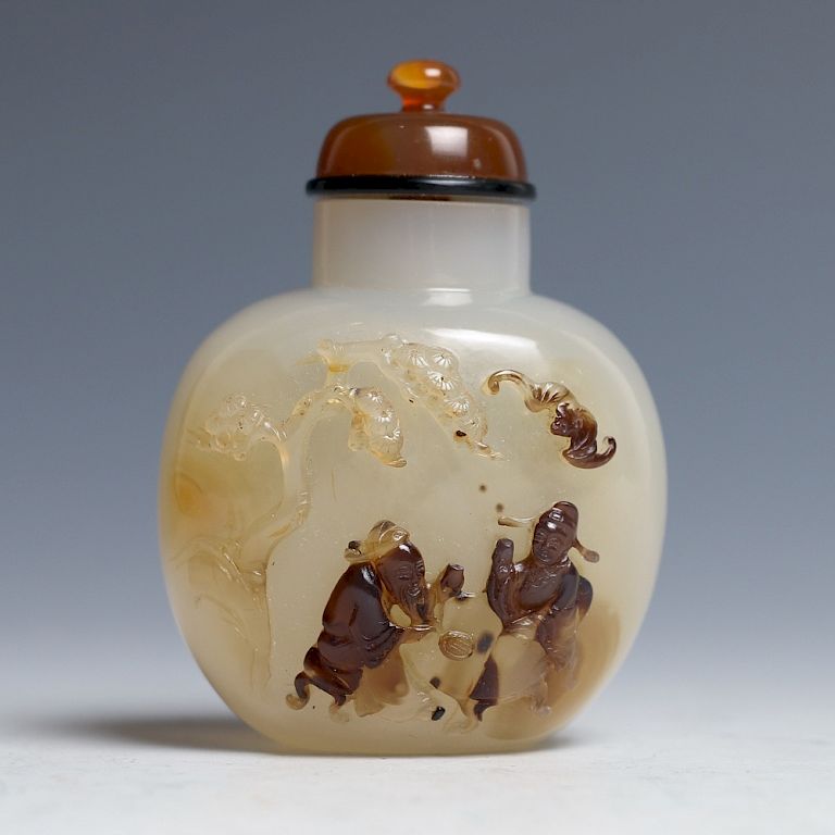 Appraisal: AGATE SUNFF BOTTLE WITH FIGURES RELIEF Of compressed globular body