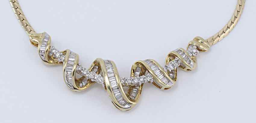 Appraisal: K DIAMOND NECKLACE K yellow gold chain and spiral diamond