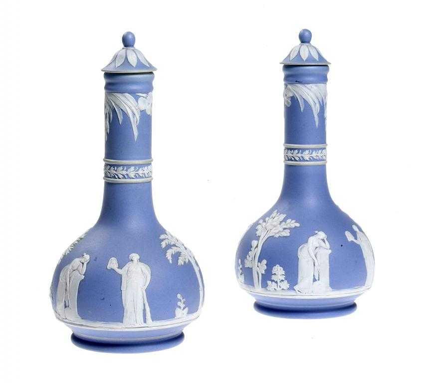 Appraisal: A PAIR OF WEDGWOOD JASPER WARE BOTTLES AND STOPPERS dipped