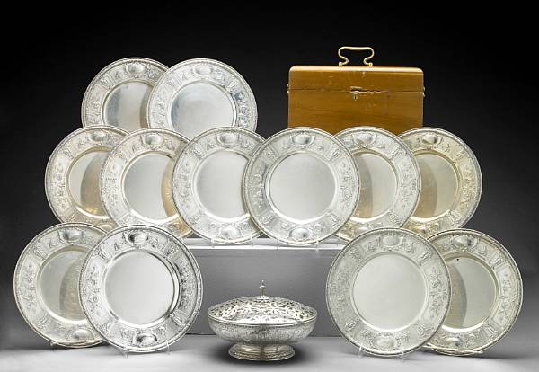 Appraisal: A sterling chased and engraved set of twelve place plates