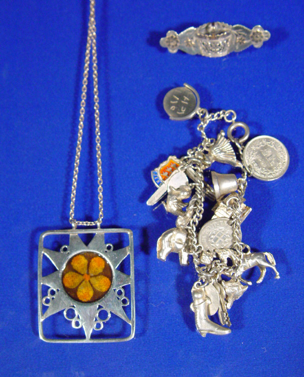 Appraisal: Silver charm bracelet silver and enamel pendant and a silver