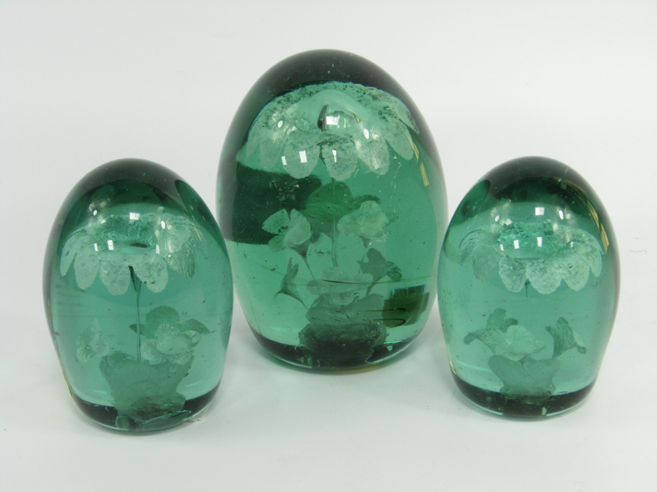 Appraisal: Three Victorain green glass dumps containing sulphide flowers one with