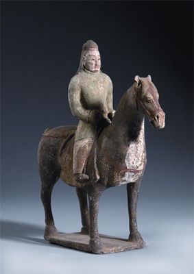 Appraisal: A Chinese unglazed and painted pottery equestrian model Warring States