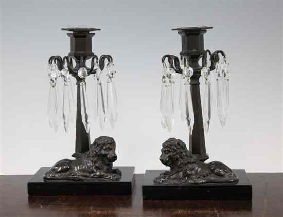 Appraisal: A pair of Regency style bronzed lustre candlesticks modelled with