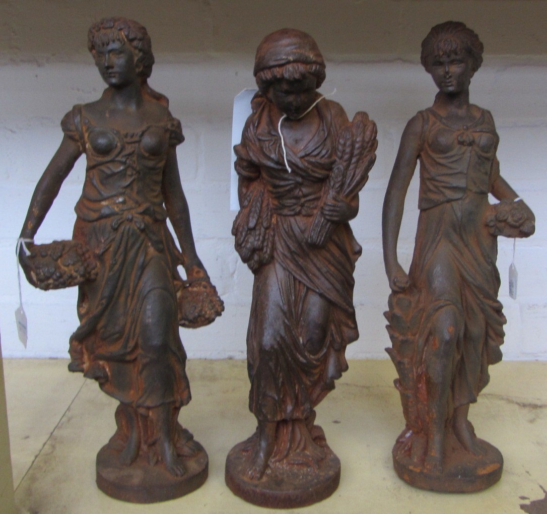 Appraisal: A group of three French cast iron figures th century