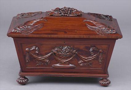 Appraisal: REGENCY CARVED MAHOGANY CELLARET The canted hinged lid with central