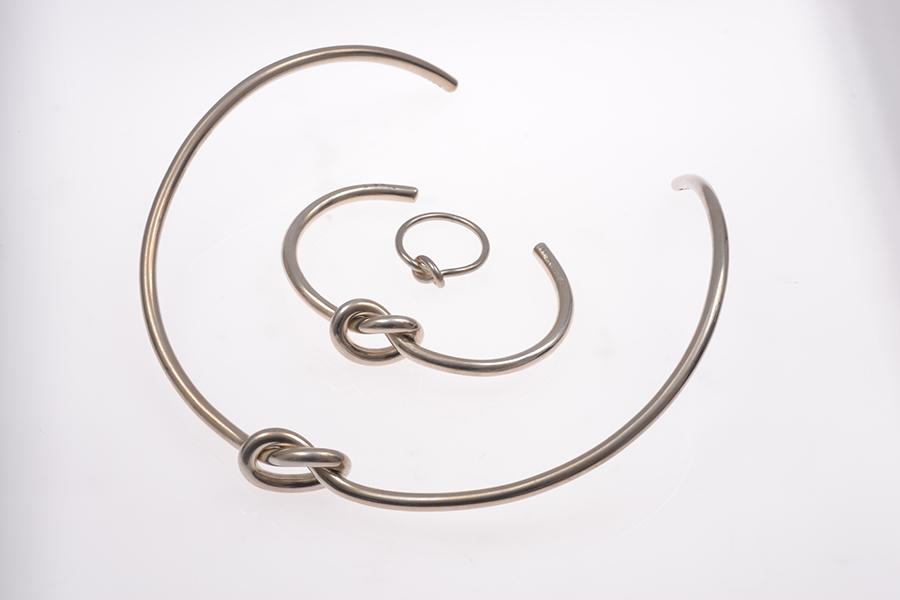 Appraisal: A GEORG JENSEN KNOT SUITE COMPRISING COLLAR BANGLE AND RING