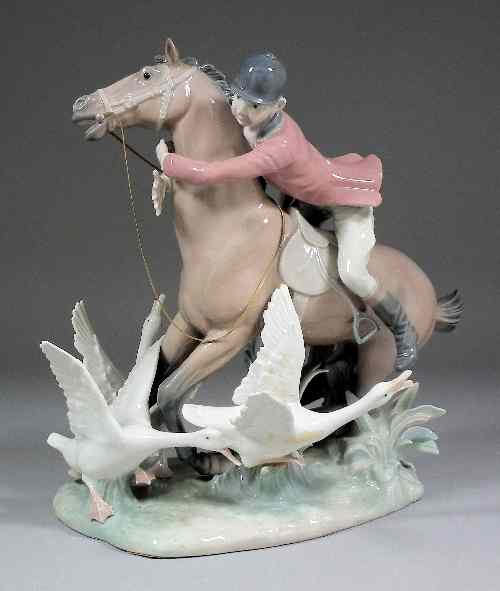 Appraisal: A modern Lladro porcelain group of a huntsman on a