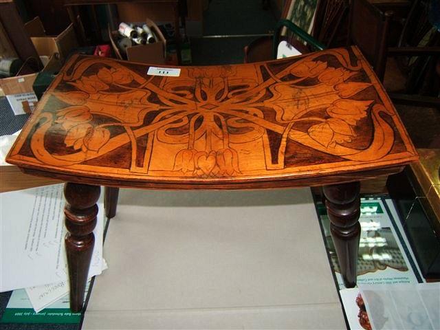 Appraisal: Art Nouveau footstool with stylised tulip penwork decoration standing on