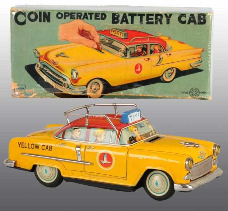 Appraisal: Tin Yellow Taxi Bank Battery-Operated Toy Description Japanese Working Made