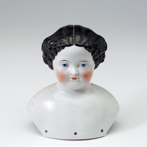 Appraisal: Large porcelain doll head with painted detail and pencil inscription