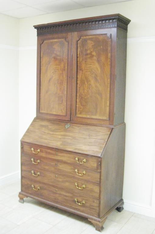 Appraisal: A George III mahogany Bureau Cabinet with dentil and pendant