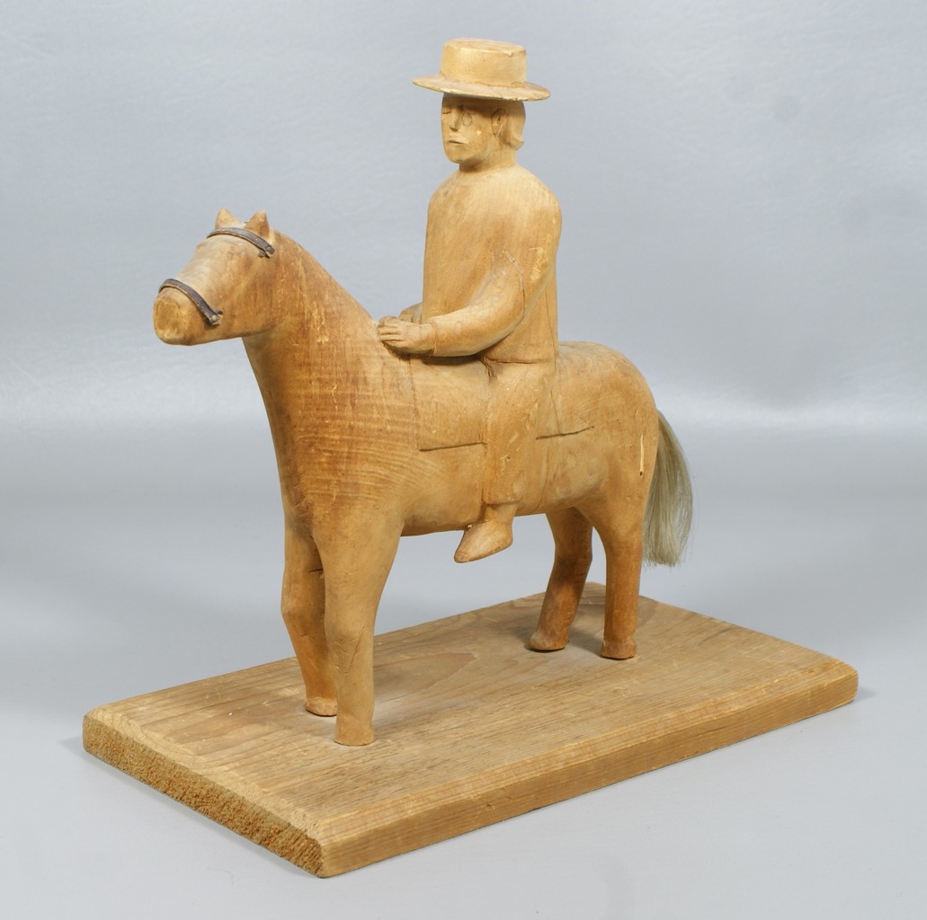 Appraisal: Carved Native American horse and rider h long