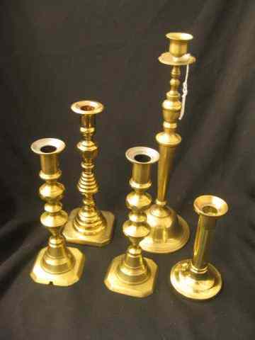 Appraisal: Brass Candlesticks one a beehive pair '' to ''