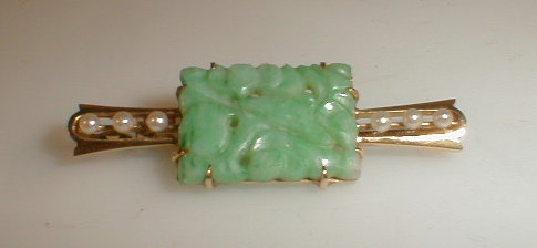 Appraisal: A thC bar brooch with applied pierced and carved rectangular