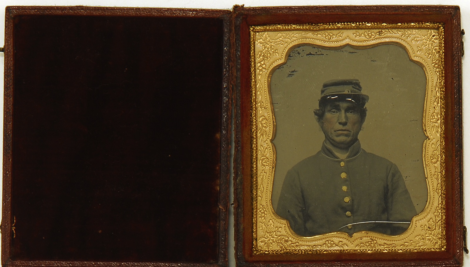 Appraisal: CASED DAGUERREOTYPE OF A CONFEDERATE SOLDIER Civil War PeriodLeather case