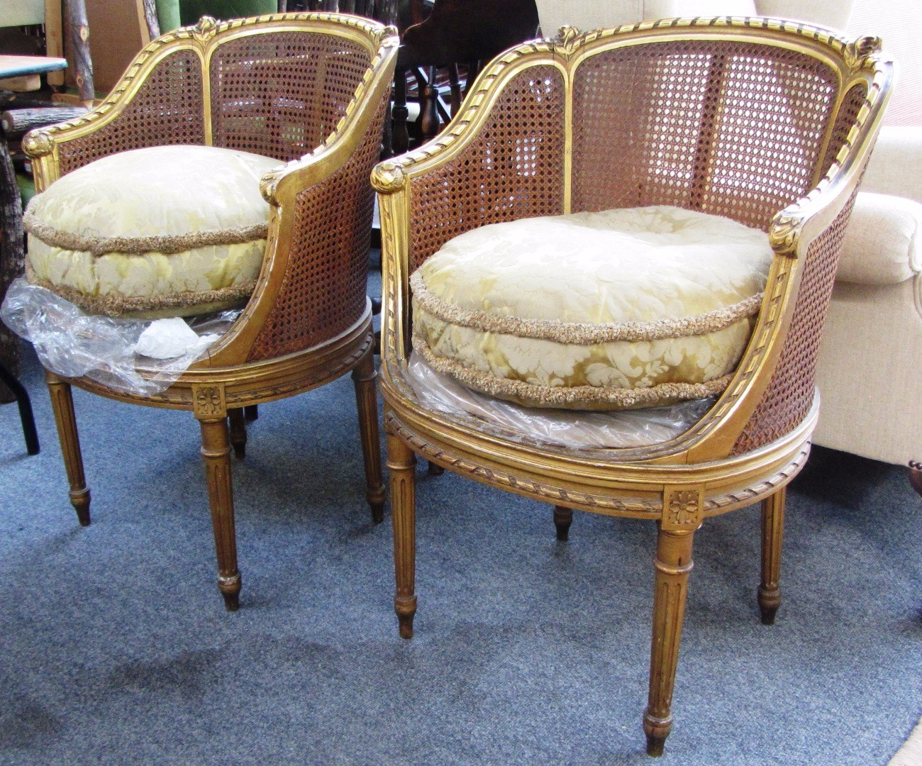 Appraisal: A pair of early th century gilt framed bergere tub