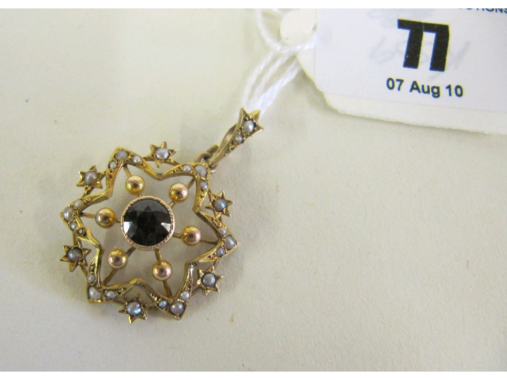 Appraisal: Edwardian ct gold garnet and seed pearl set pendant brooch