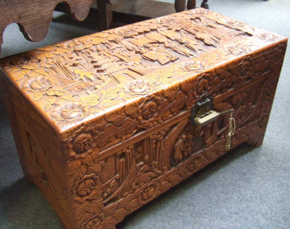 Appraisal: A th century Oriental hardwood coffer carved all over with