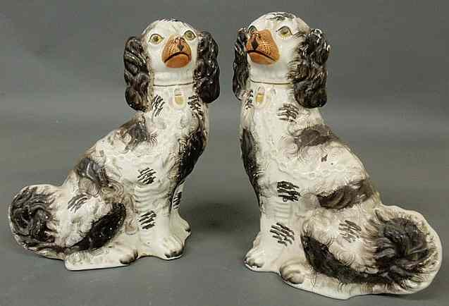 Appraisal: Large pair of th c Staffordshire seated black and white