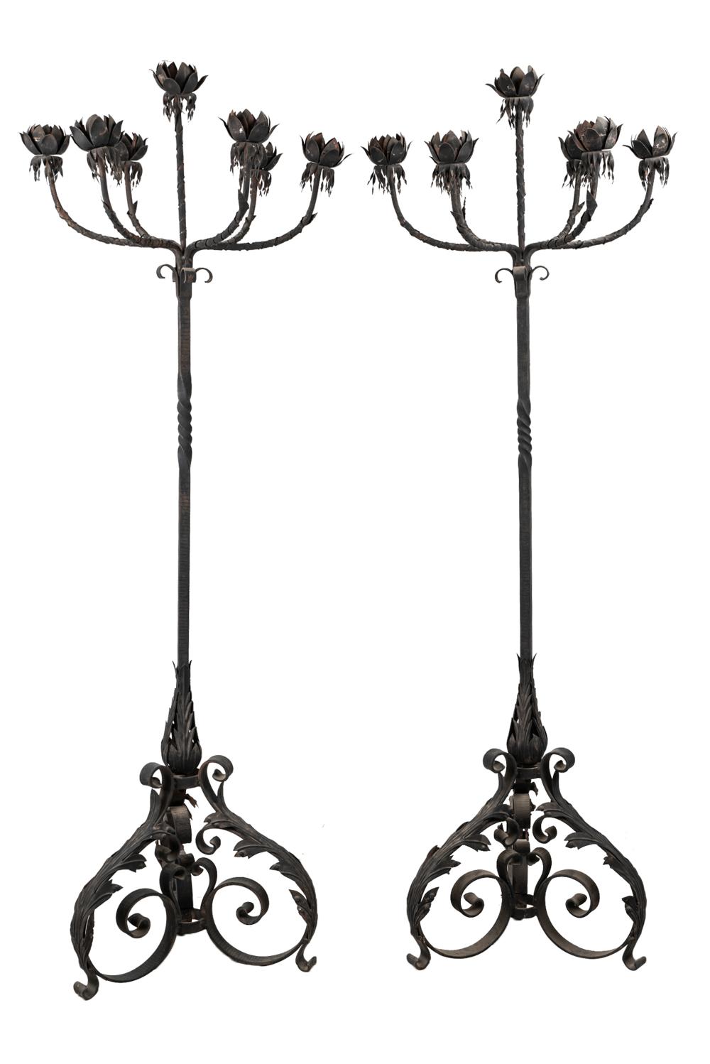 Appraisal: PAIR OF SPANISH WROUGHT IRON TOLE SEVEN-LIGHT TORCHERESCondition rust wear