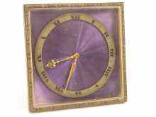 Appraisal: An day boudoire clock retailed by Asprey with amethyst coloured