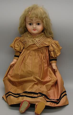 Appraisal: Unmarked Patent Washable type papier mache shoulderhead doll Stationary brown