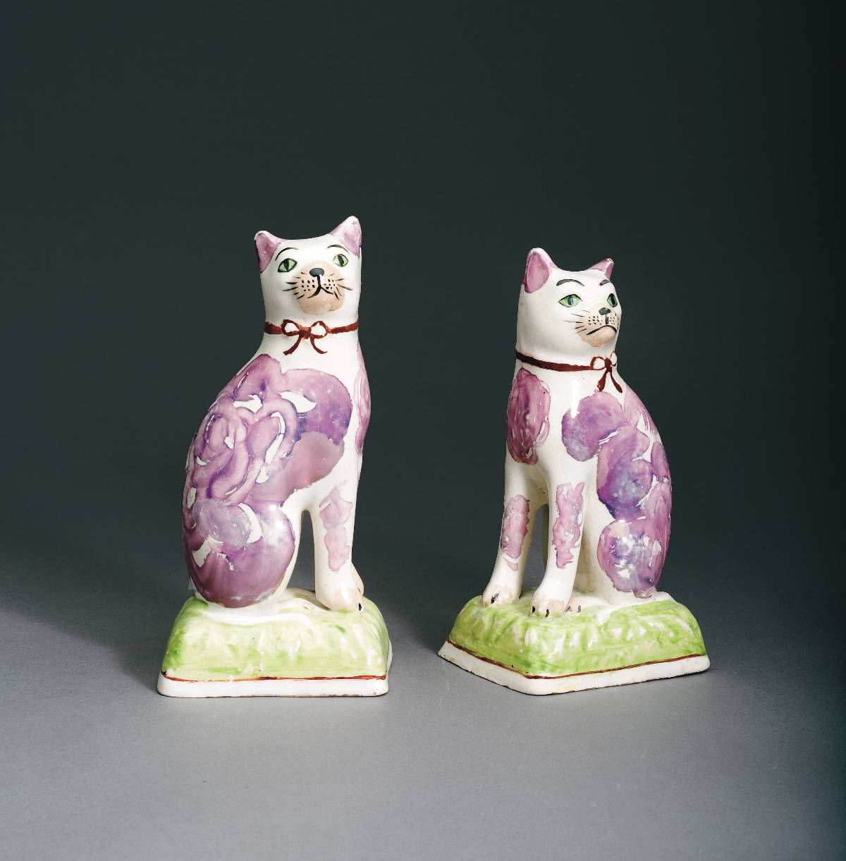 Appraisal: NEAR PAIR OF BRITISH PEARLWARE PINK LUSTRE AND ENAMEL-DECORATED FIGURES