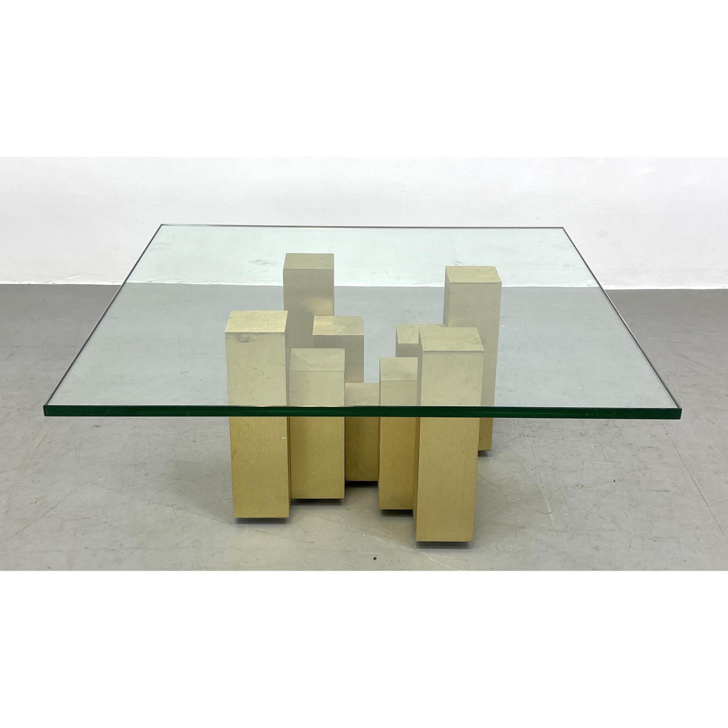 Appraisal: Brass Tone Architectural Base Coffee Table Glass Top rests on