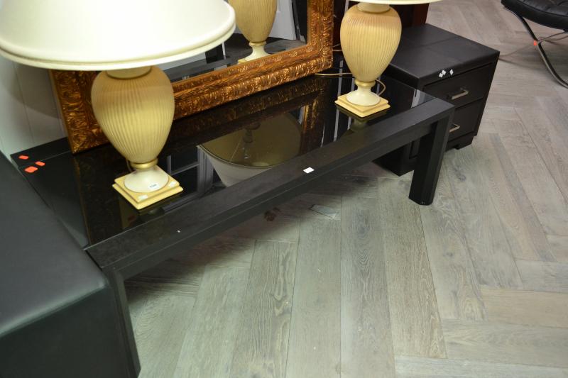 Appraisal: A CONTEMPORARY BLACK GLASS COFFEE TABLE A CONTEMPORARY BLACK GLASS