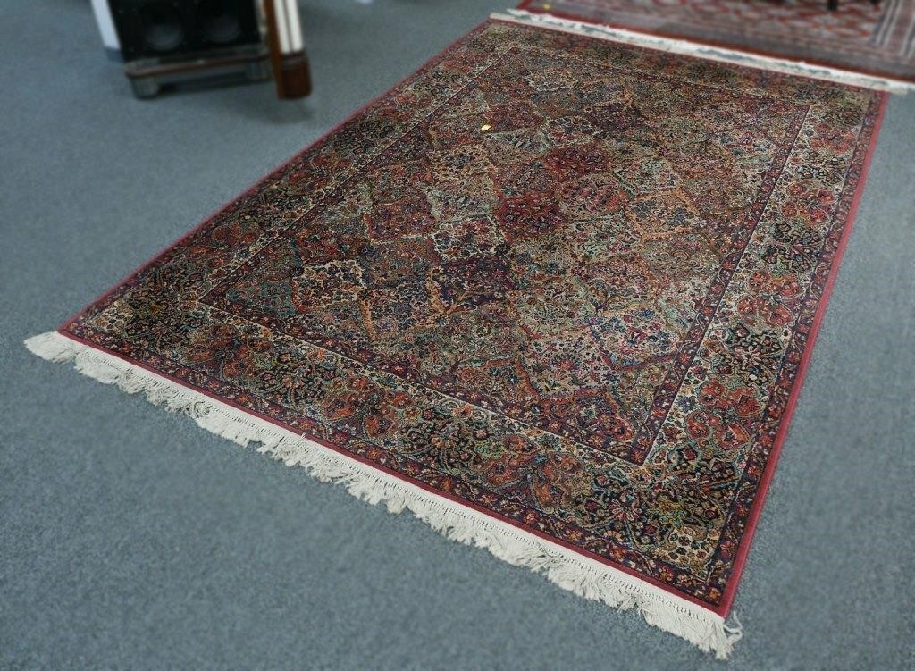 Appraisal: wool machine made rug with floral design and beautiful panels