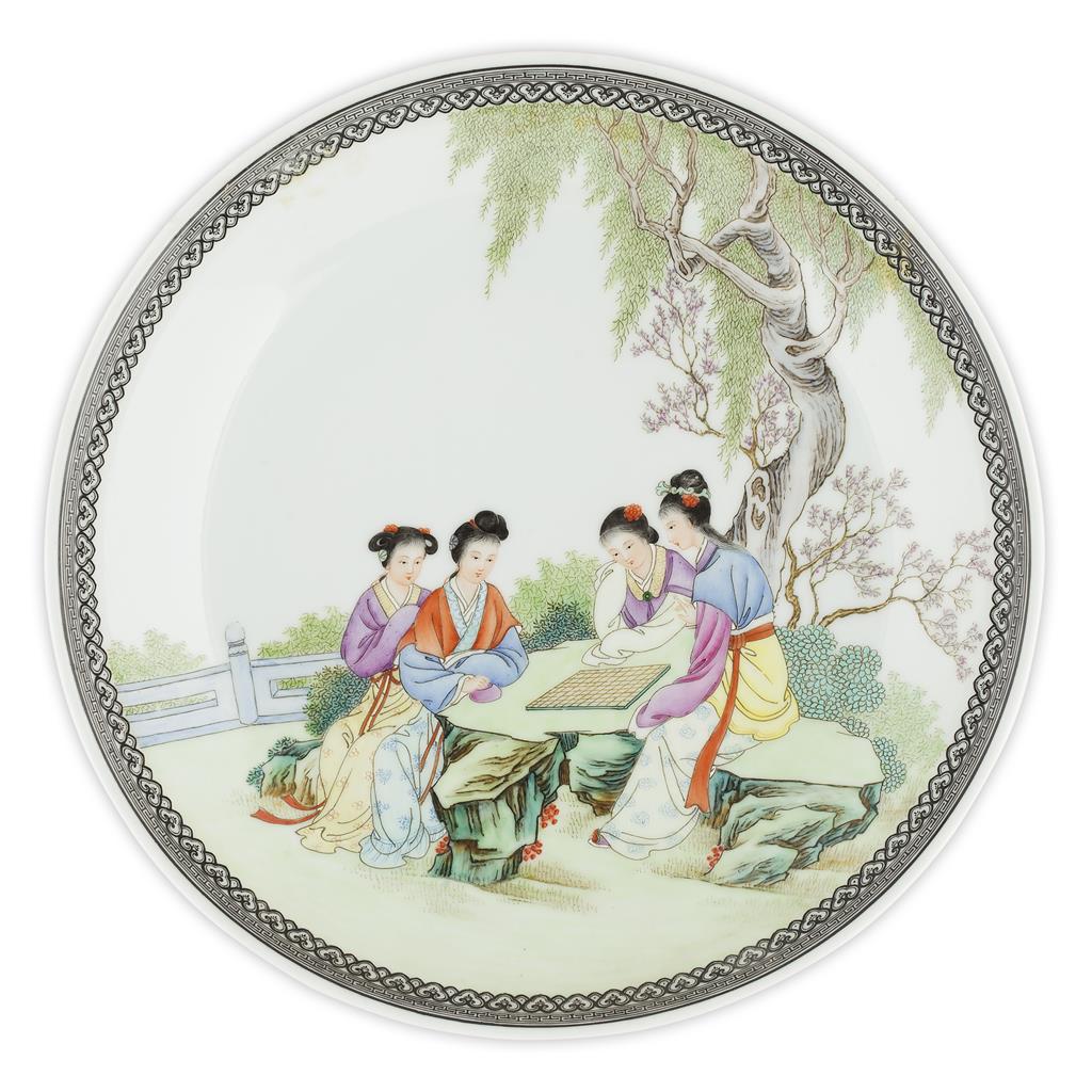 Appraisal: NEAR PAIR OF FAMILLE ROSE PLATES IN THE STYLE OF