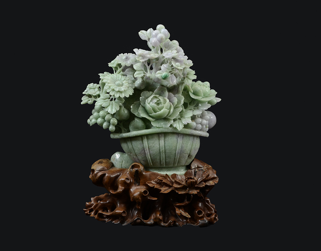 Appraisal: CHINESE CARVED JADEITE FLOWER BASKET Carved lavender and apple green