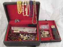 Appraisal: A leather covered jewellery box with lift out tray containing