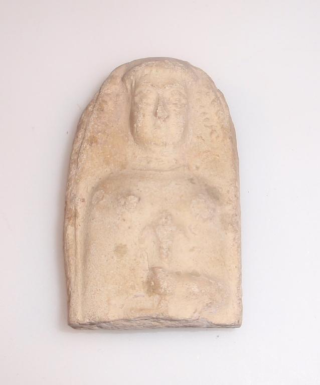 Appraisal: A moulded terracotta plaque decorated with the upper part of