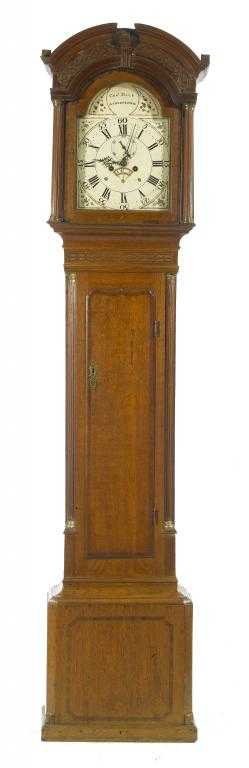 Appraisal: A GEORGE III OAK LONGCASE CLOCK the break arched and